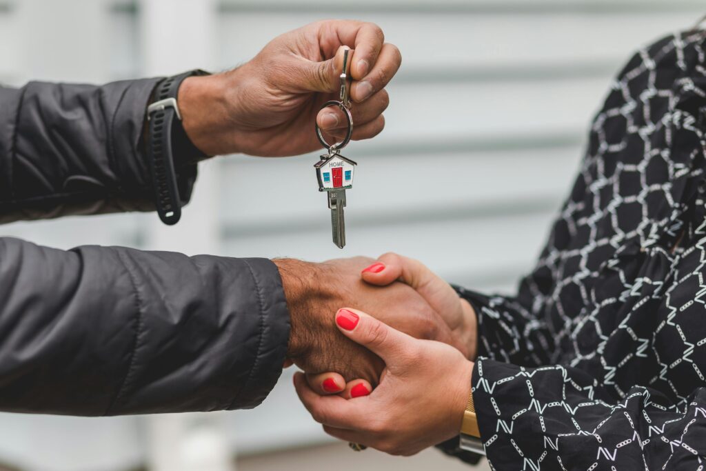 Photo of people exchanging keys