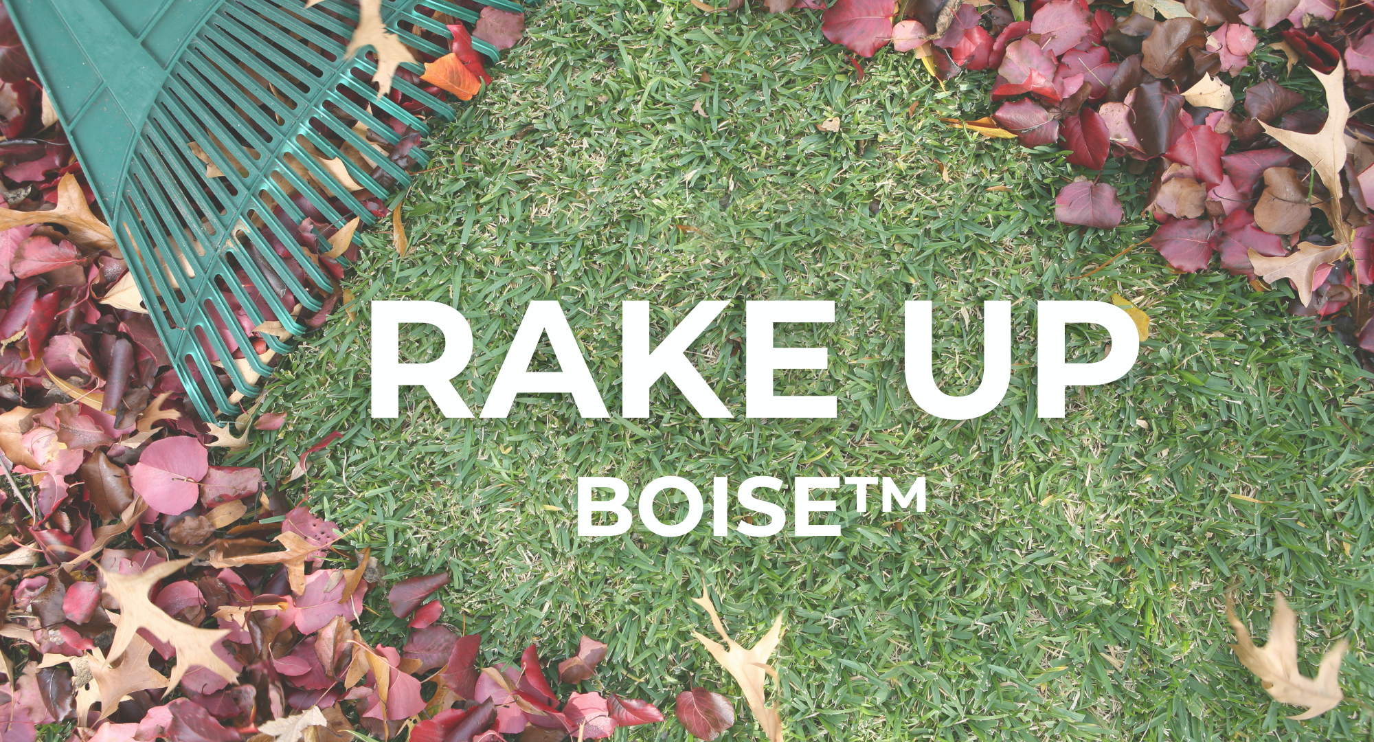 Raking leaves away to reveal Rake Up Boise name